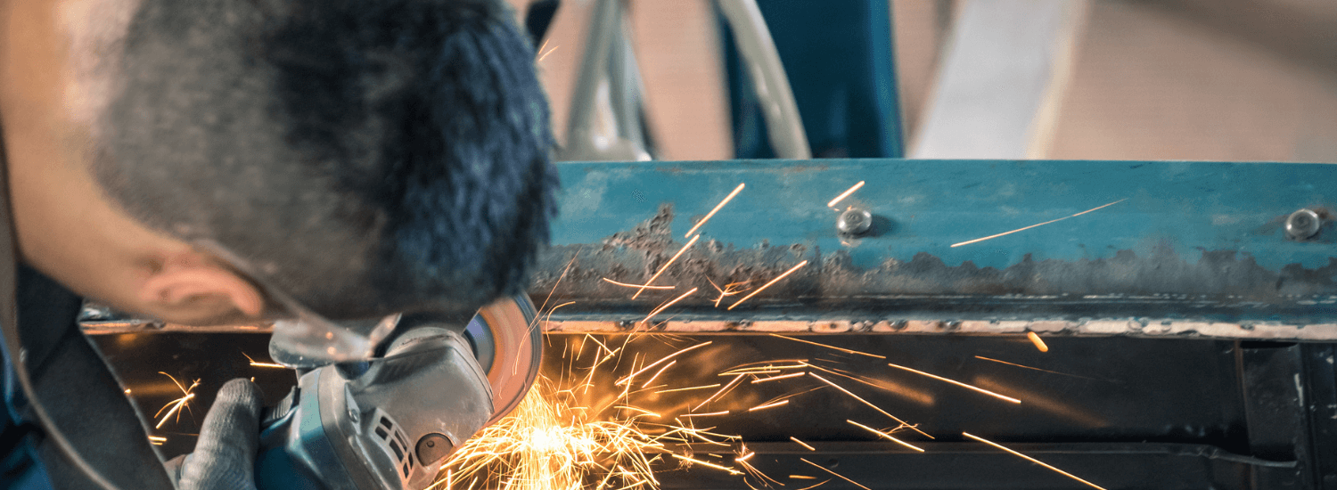 Hot Works Permit -industrial worker with metal work tool
